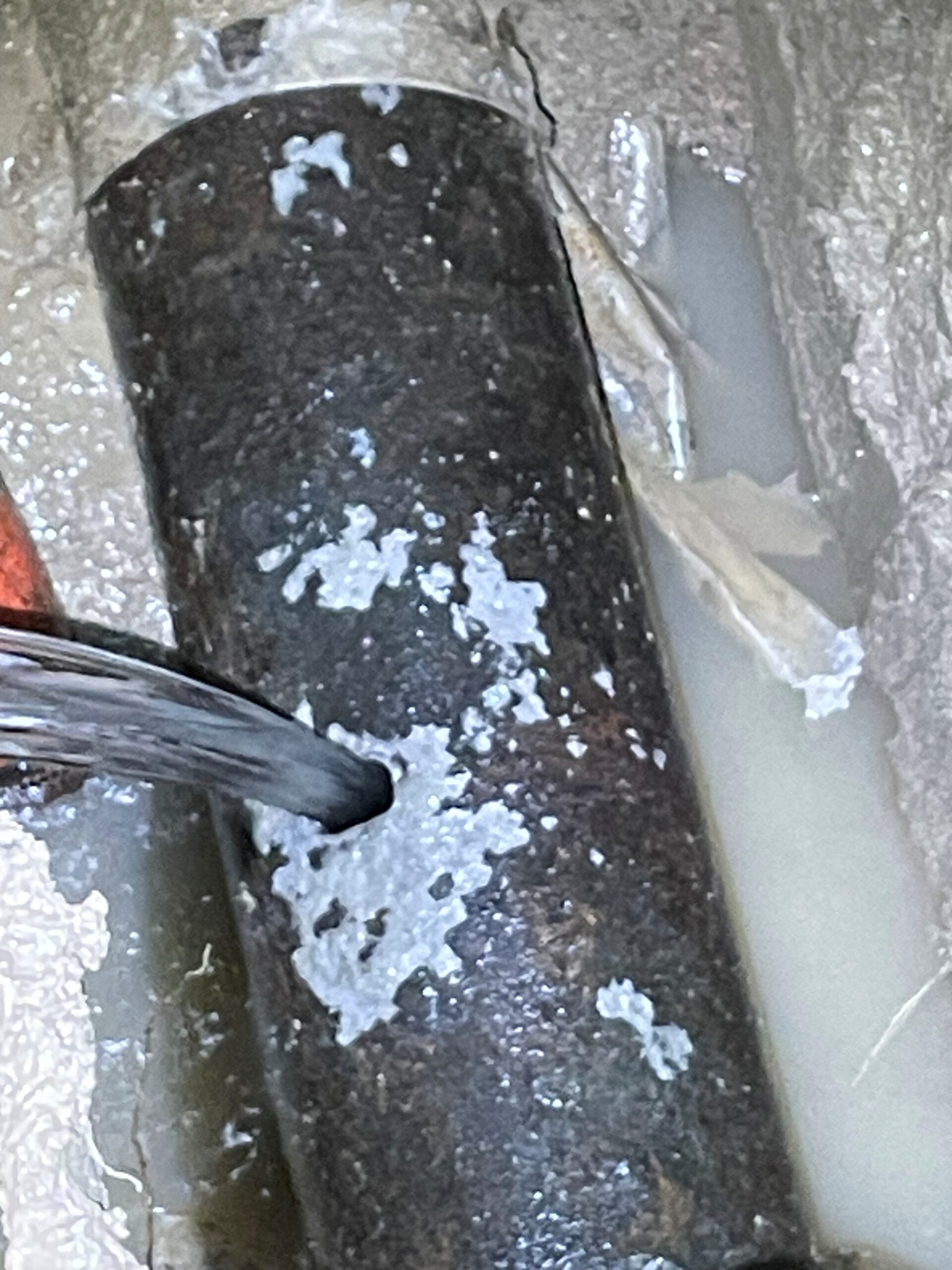 A 14” Ductile Water Main pipe that is busted and water is coming out of it
